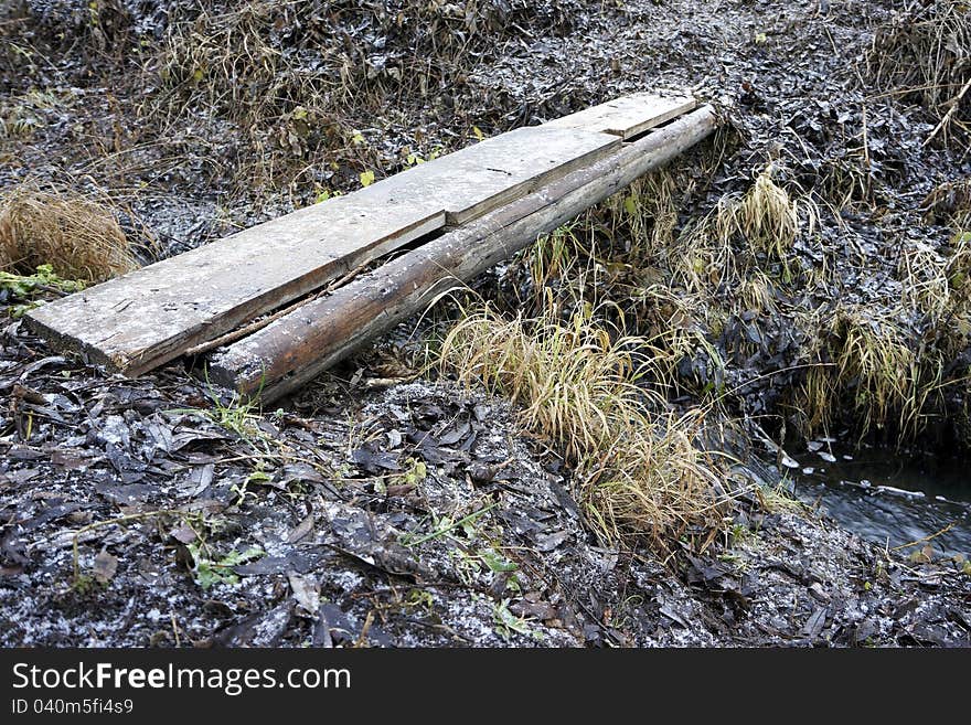 Plank Across Melioration Stream During Winter