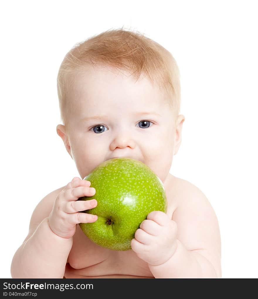 Baby boy eating green apple over white