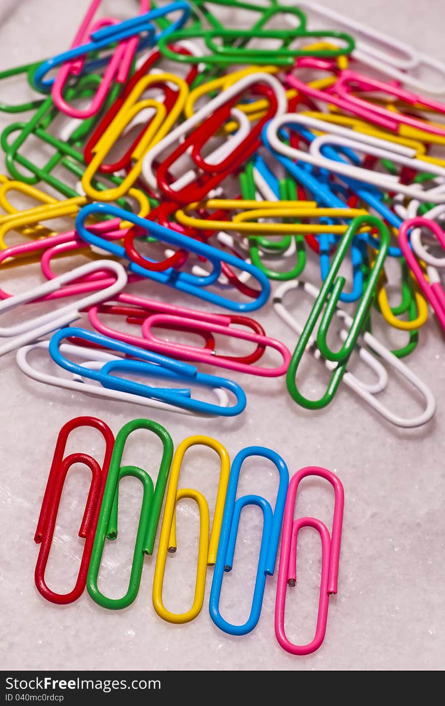 Heap of paper-clips in many colors