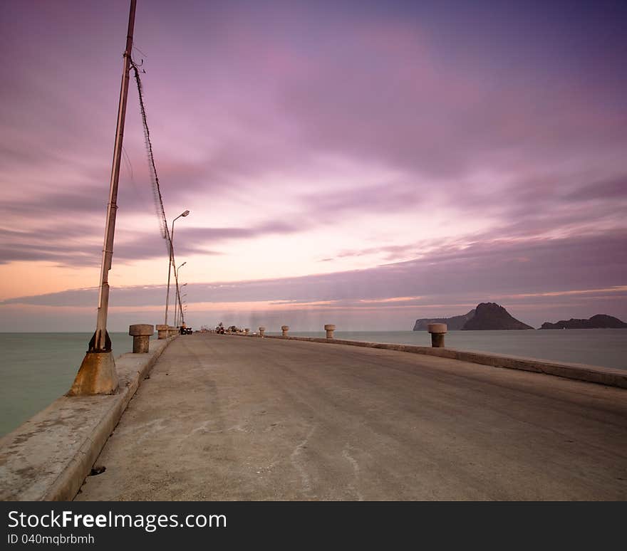 Lonely pier with dramatic cloudy while sunrise. Lonely pier with dramatic cloudy while sunrise