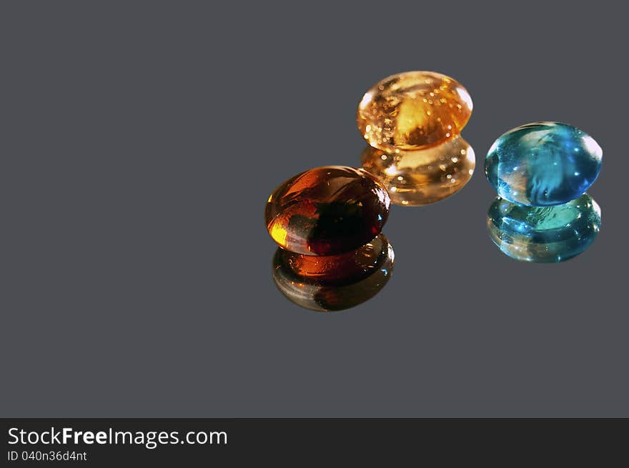 Glass Stones On A Gray Background