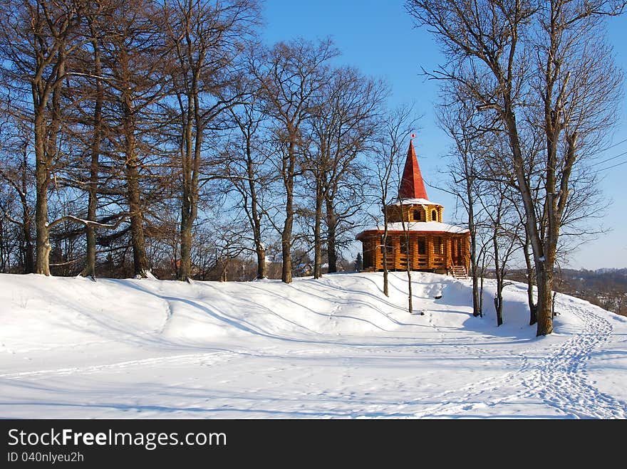 Wooden Arbor In Park In The Winter