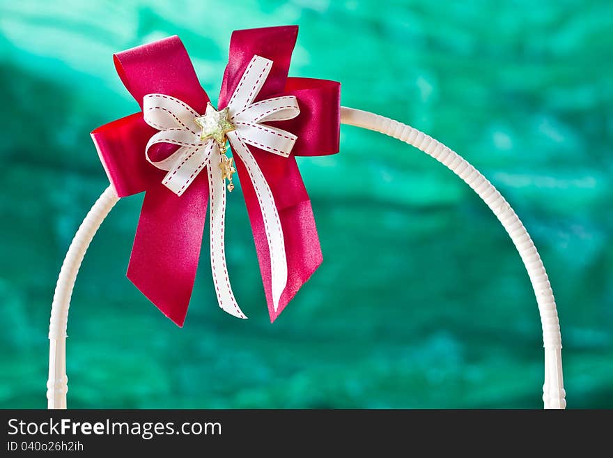 Close-up Red gift ribbon on green background. Close-up Red gift ribbon on green background