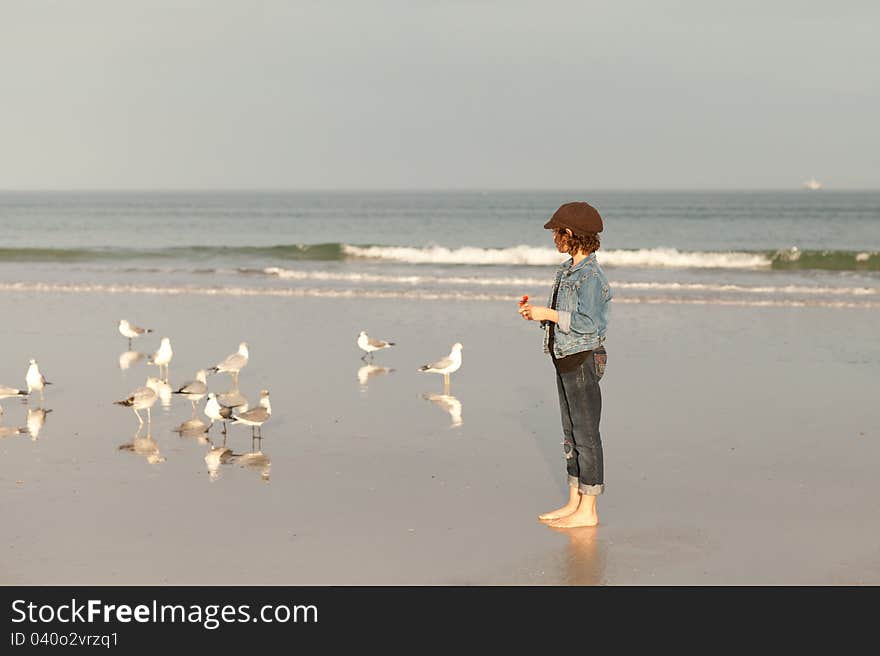 Girl On Beach With Seagulls