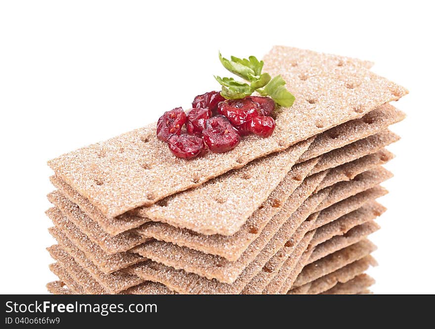 Stack of crispbread on white background ,reflection, blueberry red, green leaf