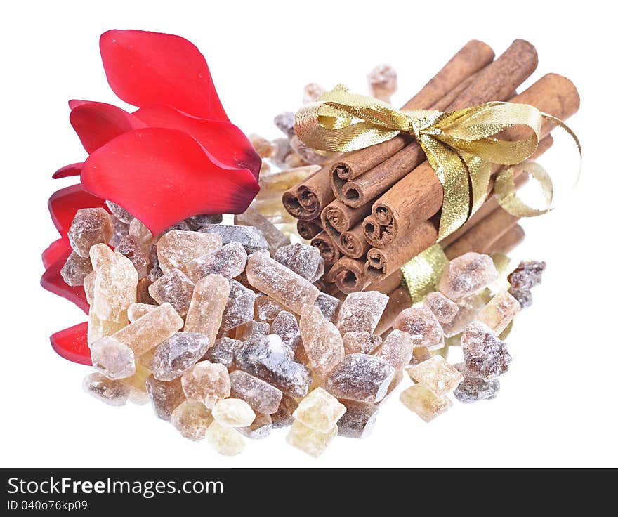 Cinnamon sticks with pure cane brown sugar on white background,reflection