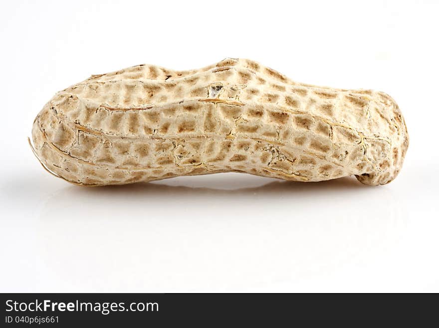 Closeup of a peanut with white background. Closeup of a peanut with white background.