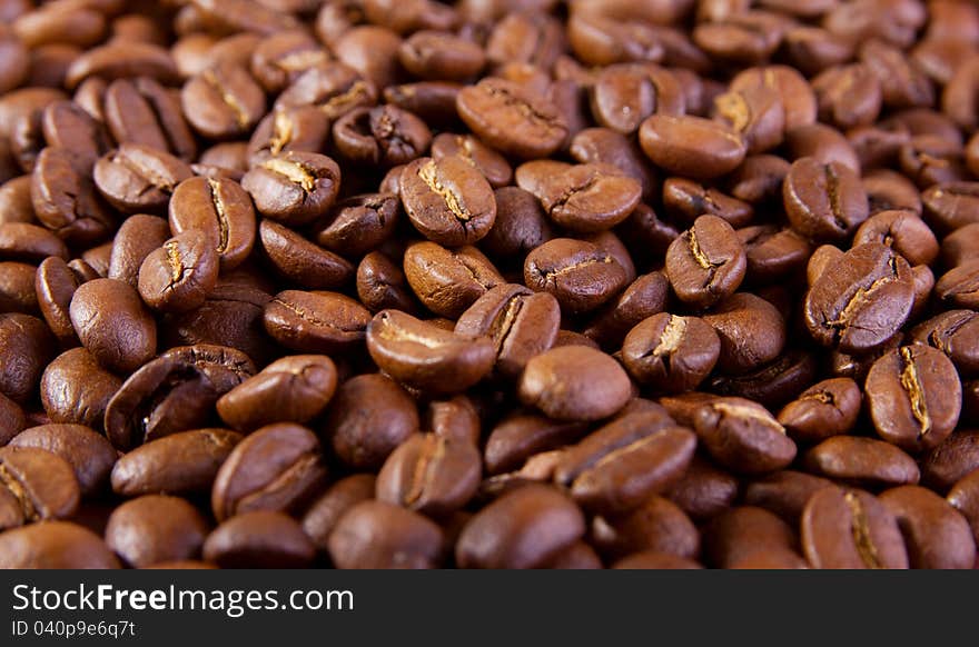 Brown background of many coffee beans. Brown background of many coffee beans