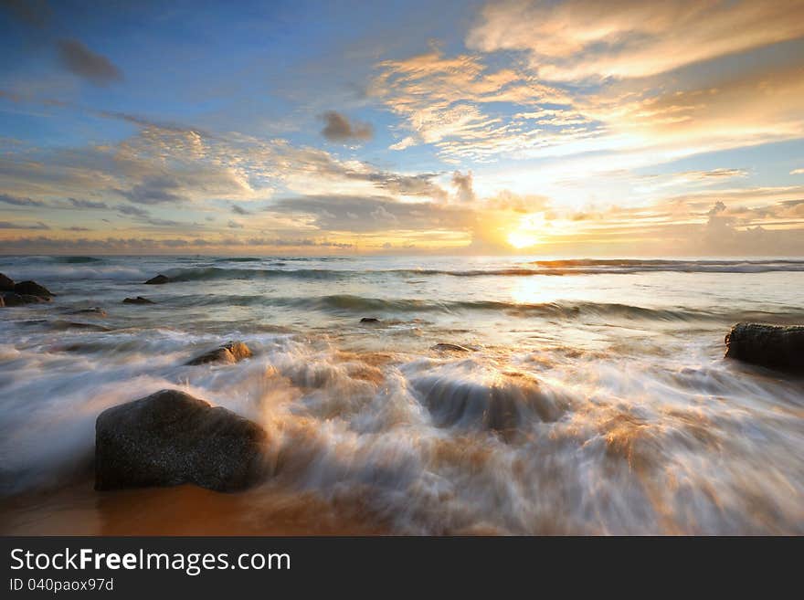 Sea waves lash line impact rock onthe beach. Sea waves lash line impact rock onthe beach