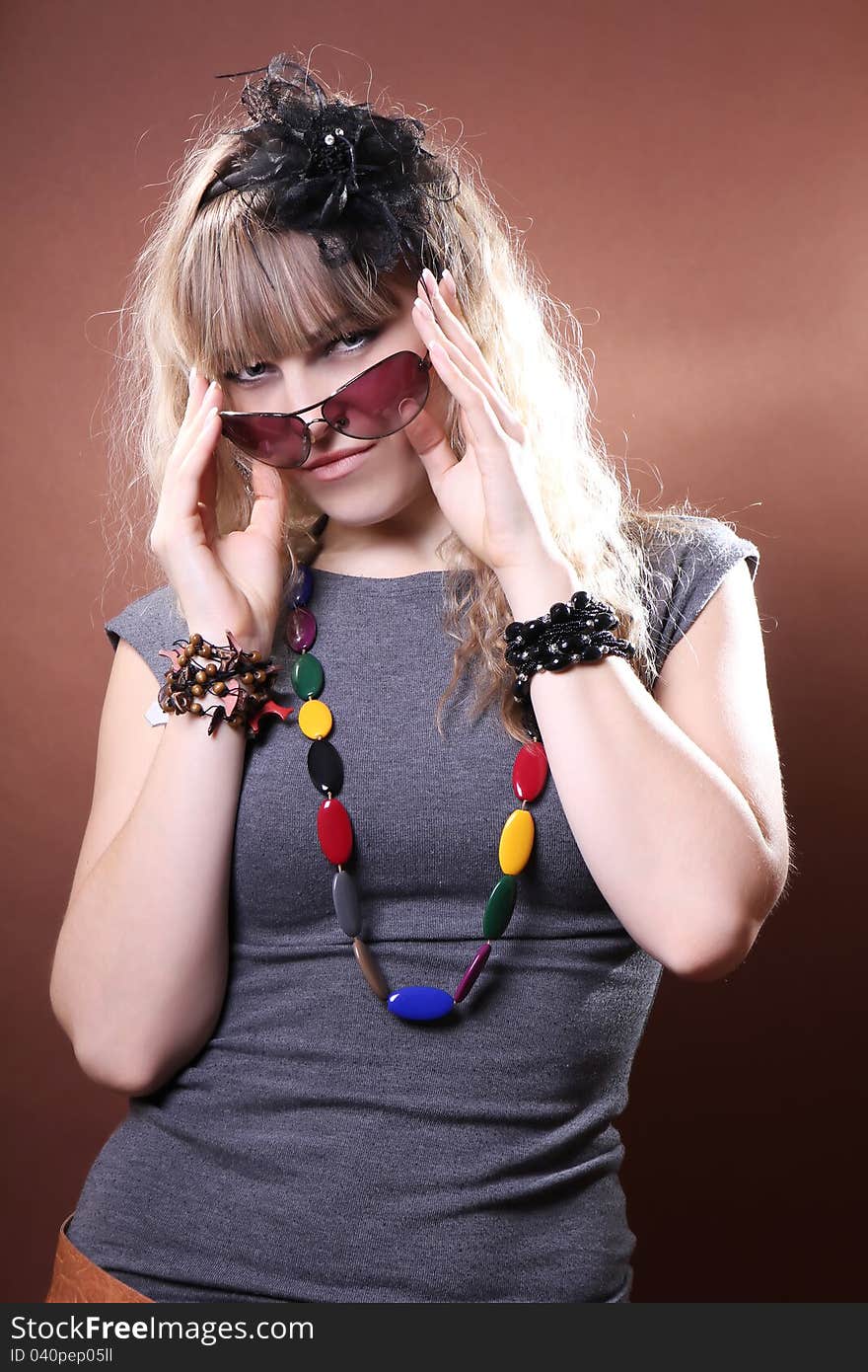 Stylish girl on a brown background