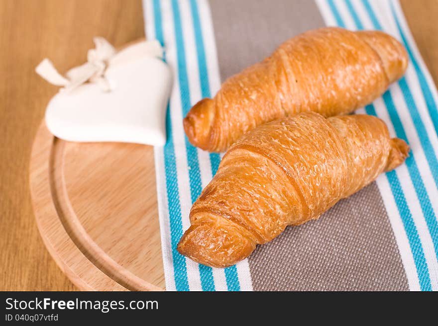 Croissants on a beautiful napkin. Croissants on a beautiful napkin