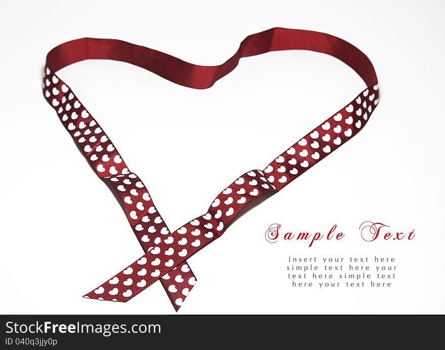 Red ribbon with heart shape