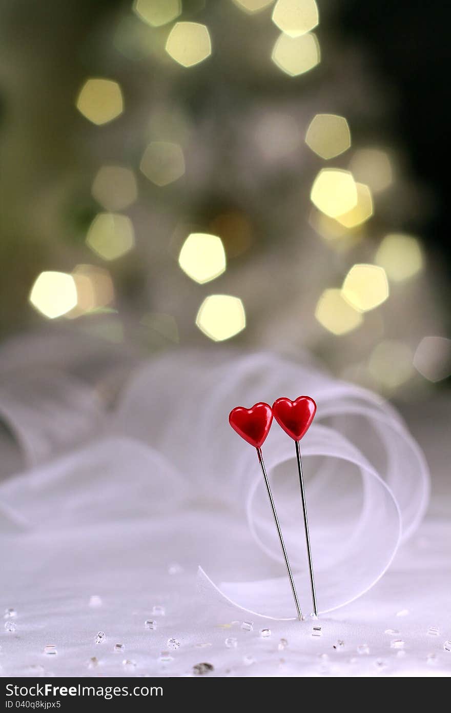 Image of a red heart pins with ribbon on valentines day