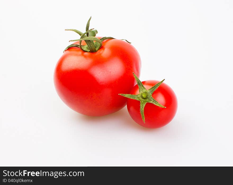 Fresh tomatoes isolated on white