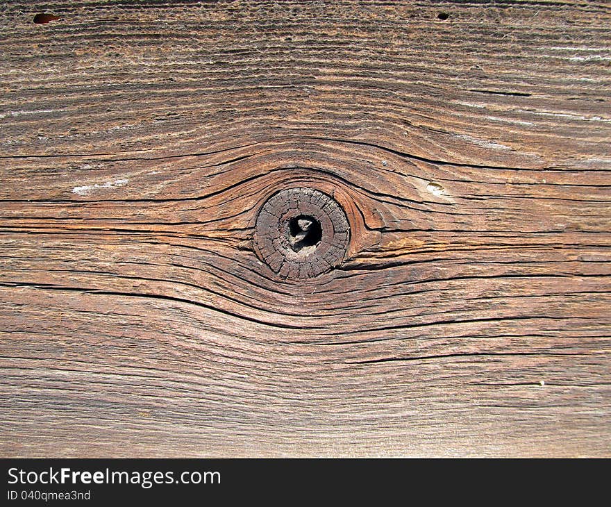 Old wooden board with knot detail at. Old wooden board with knot detail at