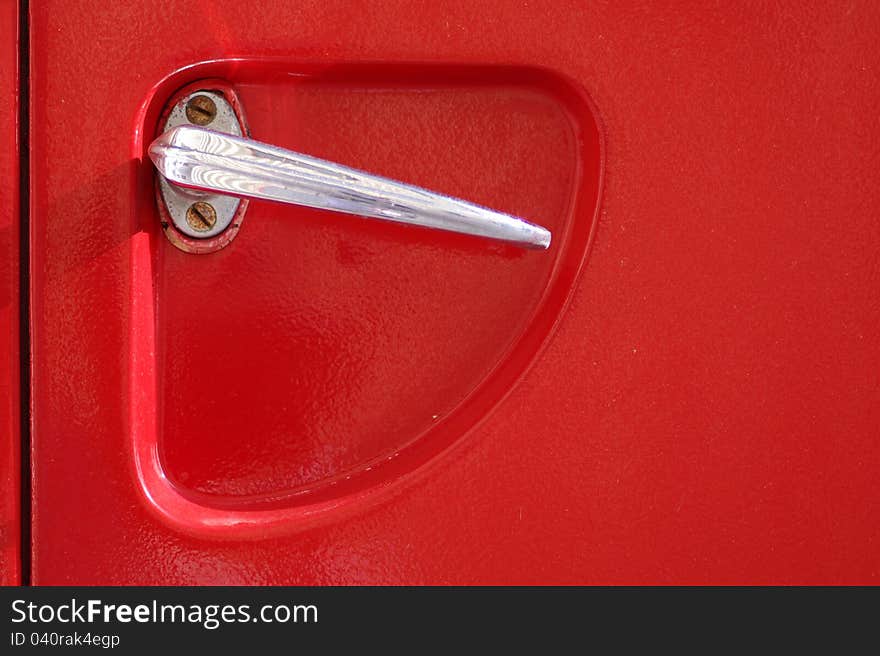 Detail of the door handle of a 60's firetruck. Detail of the door handle of a 60's firetruck