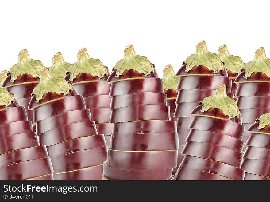 Many sliced aubergines (eggplants) on a white background with copy space. Many sliced aubergines (eggplants) on a white background with copy space