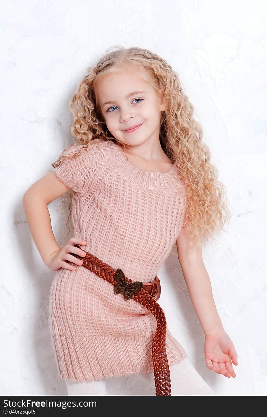 Little girl in knitted dress