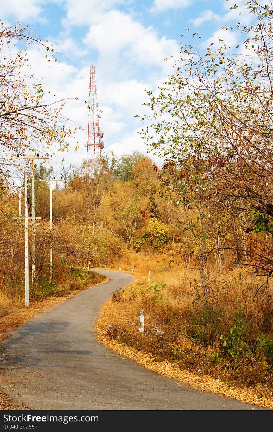 Mountain Road in autumn, leading to a telecommunications tower