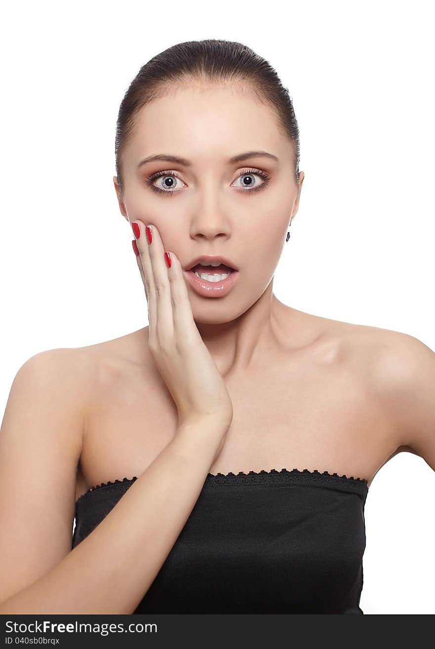 Portrait of a surprised young women with hands over her mouth laughing against white background. Portrait of a surprised young women with hands over her mouth laughing against white background