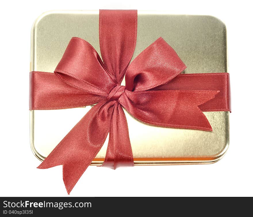 Steel metal gift box with red ribbon, on a white background