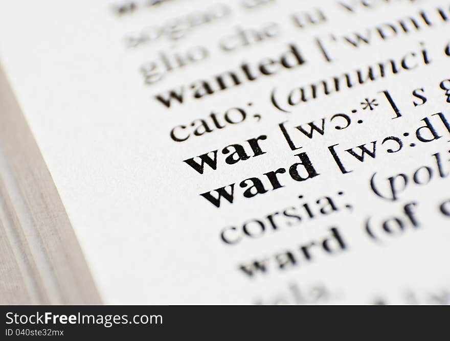 The word War from the dictionary - horizontal macro shot.