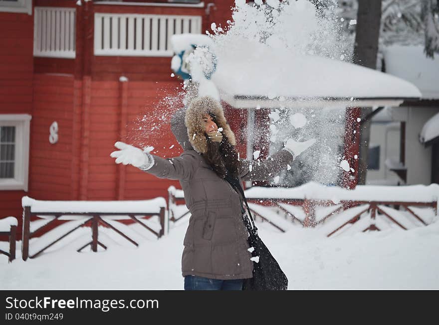 Girl who throw snow in the air