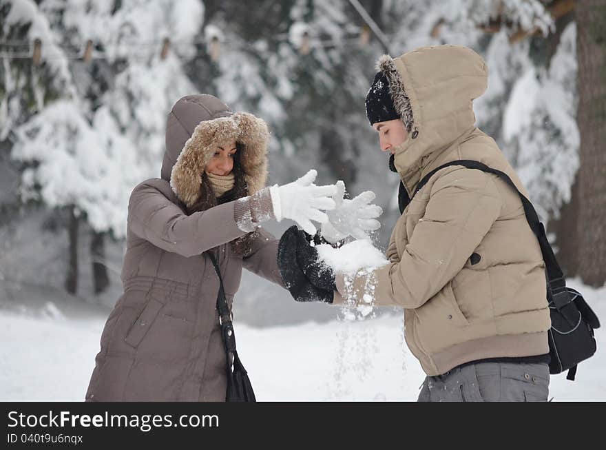 Girl and boy playing with snow in the mountain. Girl and boy playing with snow in the mountain