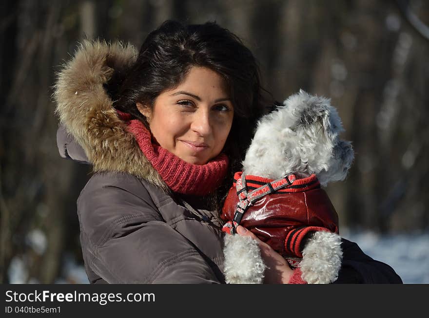 Girl with her small dressed dog