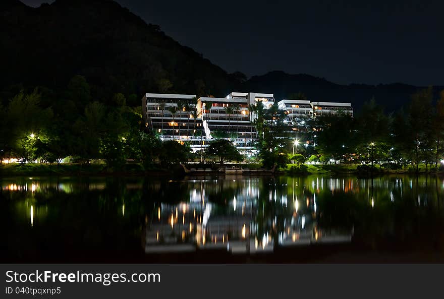 Hotel at night, the reflection in the sea