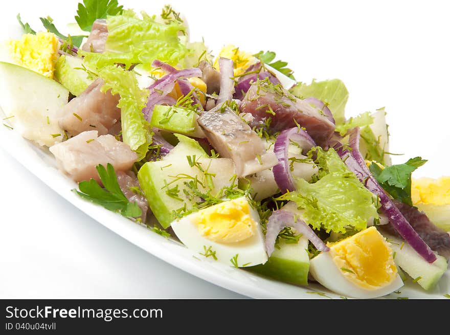 Herring salad on a white background. Herring salad on a white background