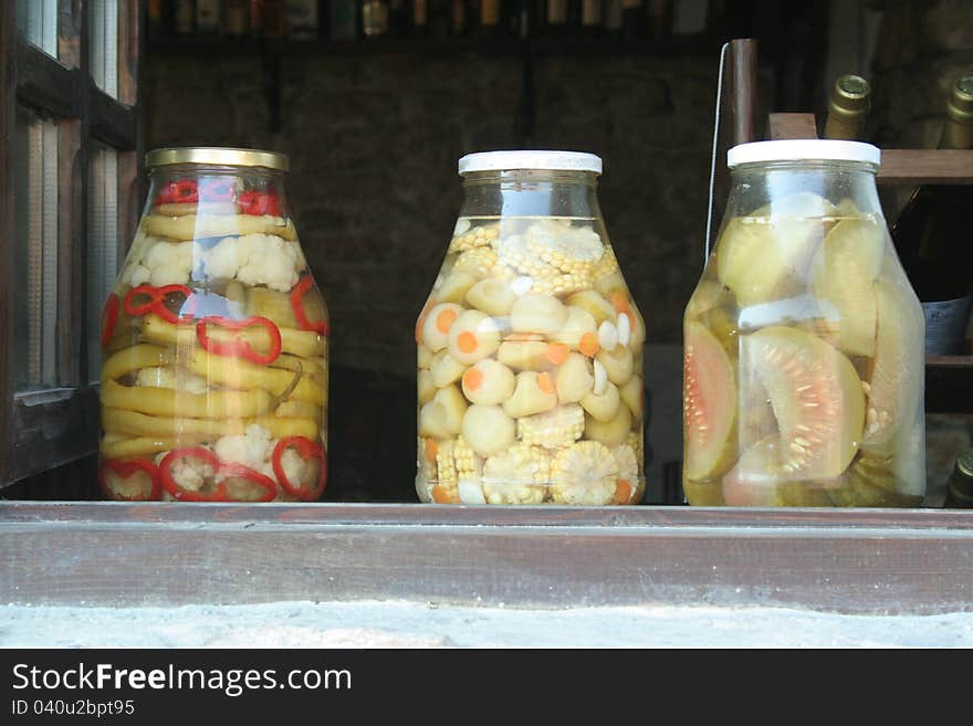 Glass jars of pickled vegetables. Decorative used in the kitchen.