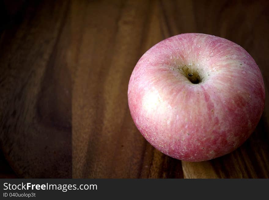 Apple On Wooden