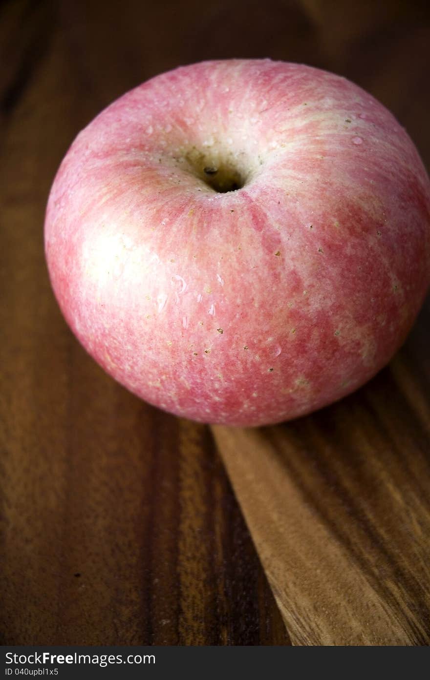 Pink Apple On Wooden Tray