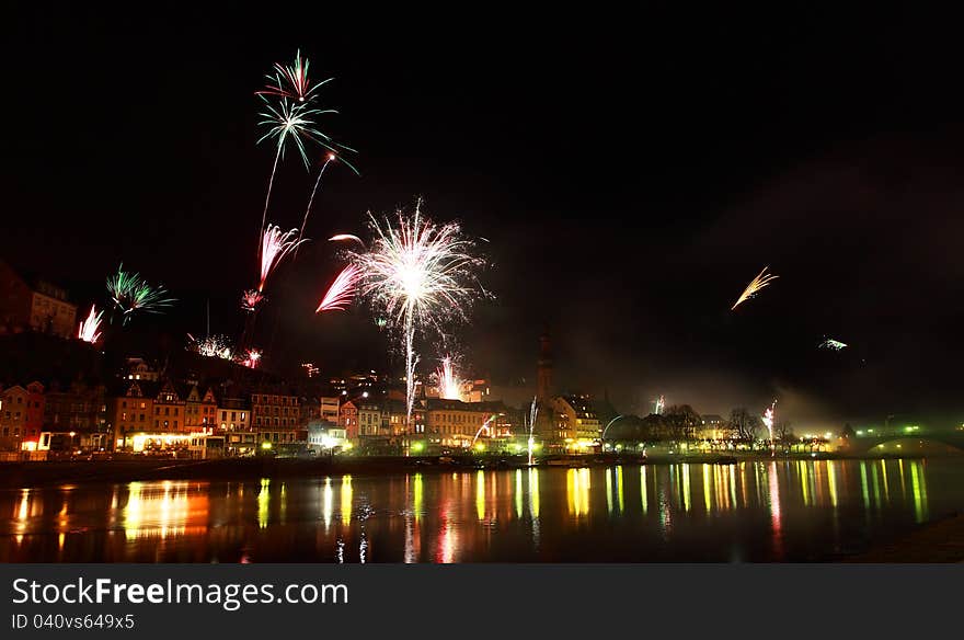 Multicolor fireworks in small German town Cochem close to river. Multicolor fireworks in small German town Cochem close to river