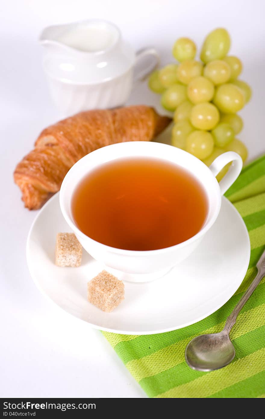 Delicious Breakfast. A Cup Of Tea, Croissant And G