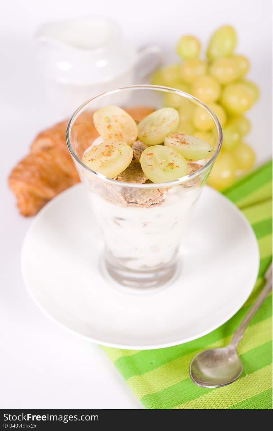 Muesli, Yoghurt, Croissants And Grapes