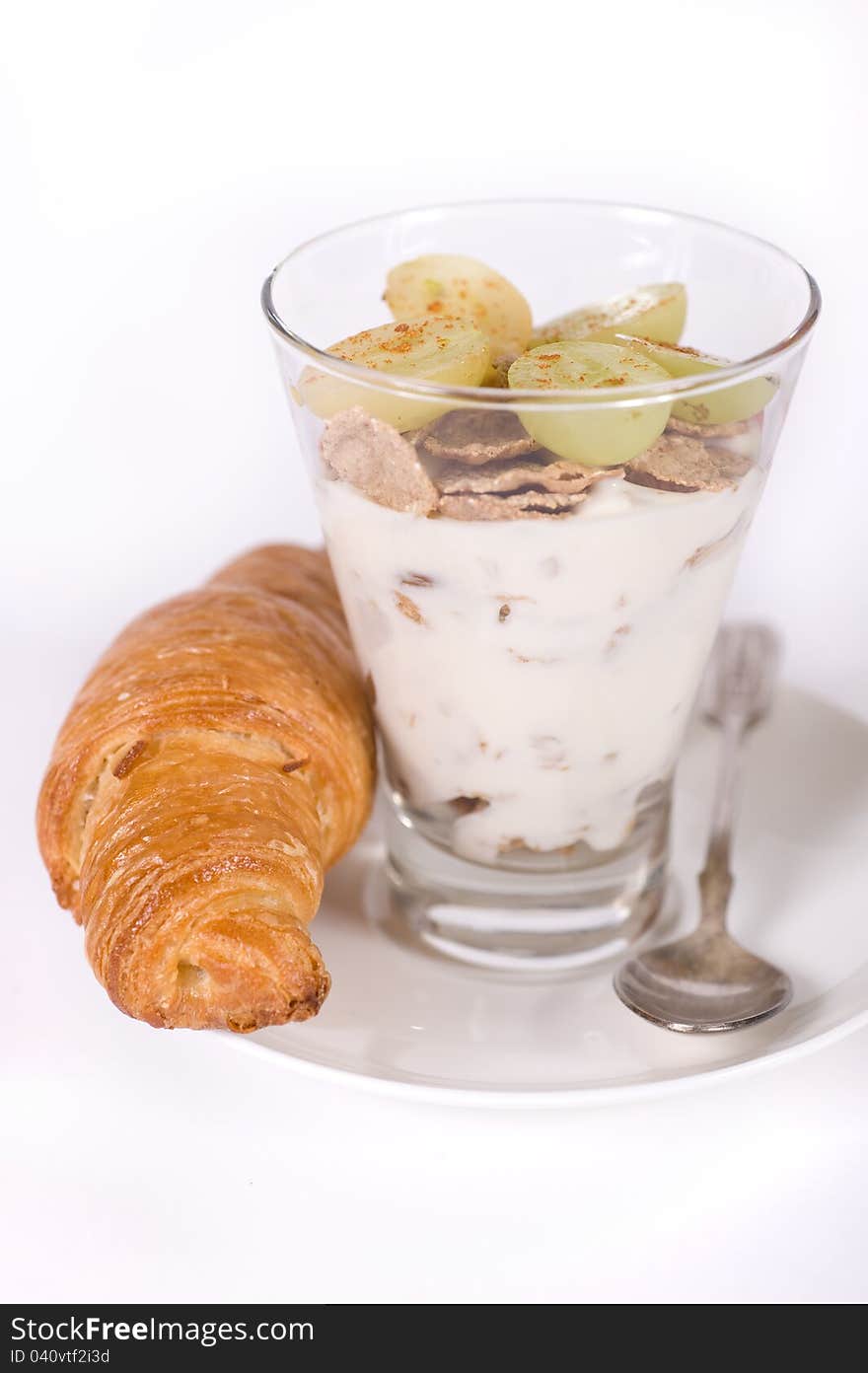 Breakfast. Muesli, yoghurt, croissants and grapes. Breakfast. Muesli, yoghurt, croissants and grapes