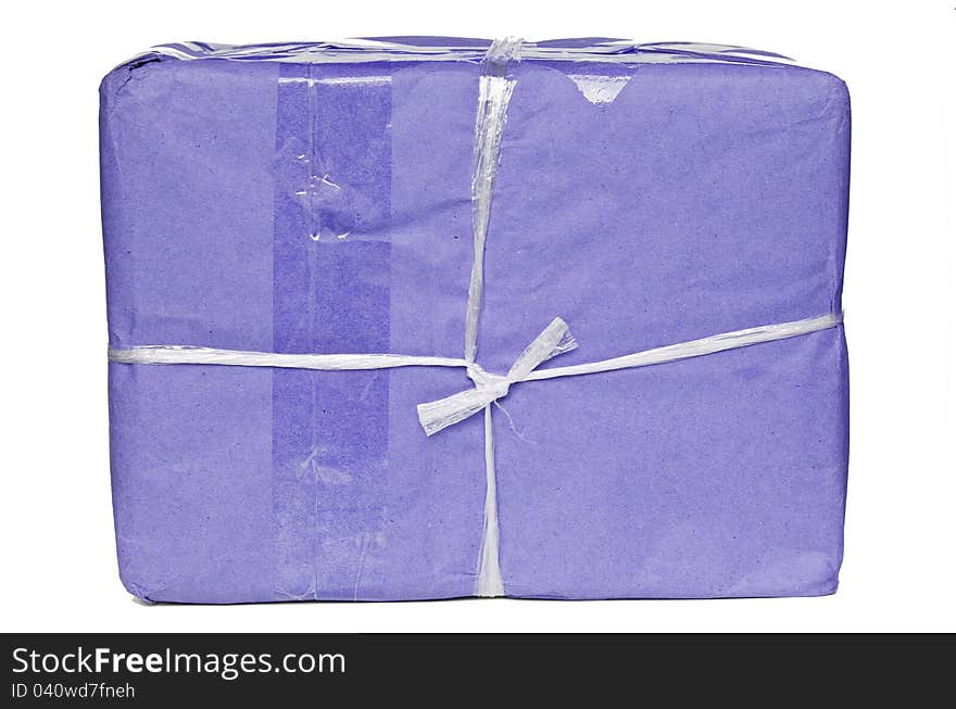 A parcel wrapped in purple paper and tied with rough twine and blank label,  on white background