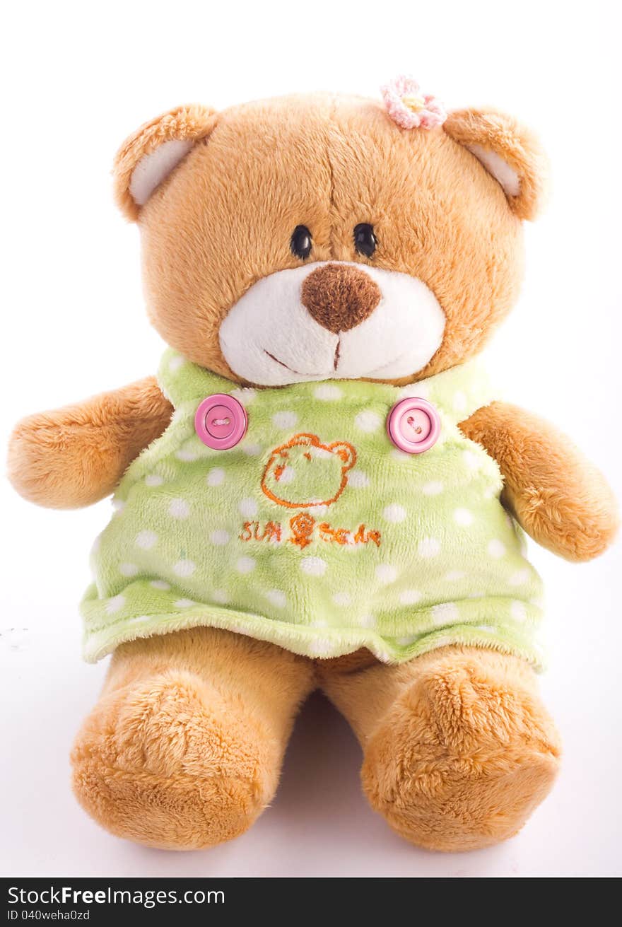 A brown teddy bear on white background