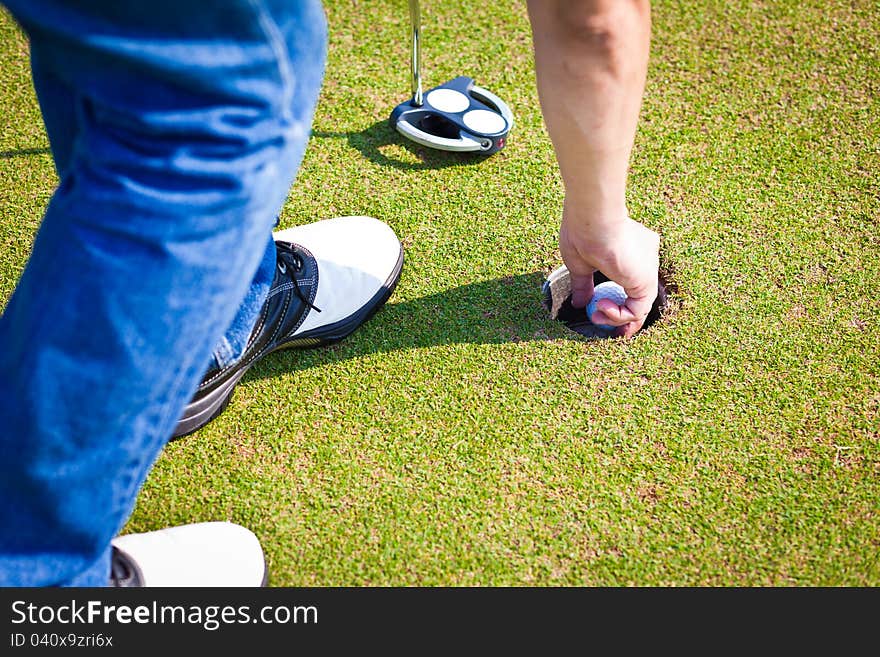 Person holding golf ball