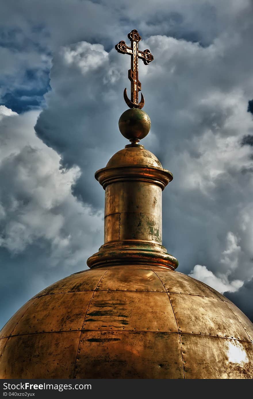 Golden dome of the church against the sky