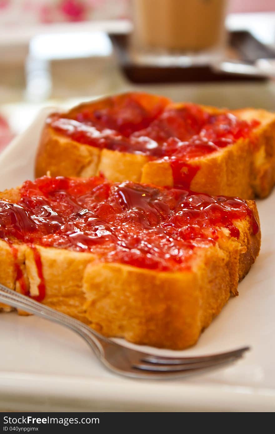 Slice of bread with red jam