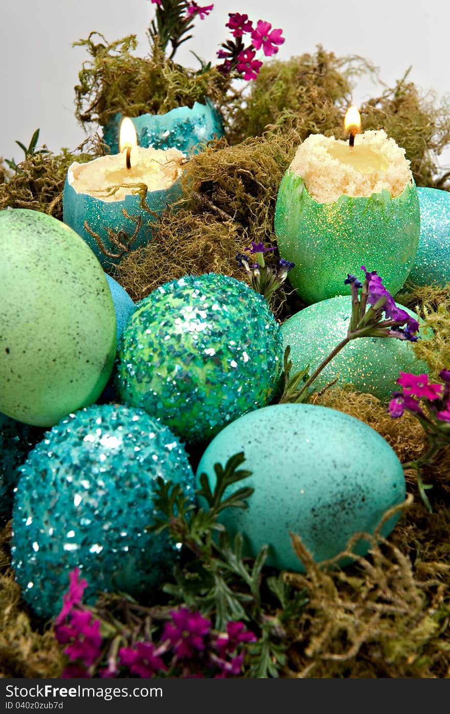 Easter decoration - green and blue dyed eggshell candles. Selective focus. Easter decoration - green and blue dyed eggshell candles. Selective focus.