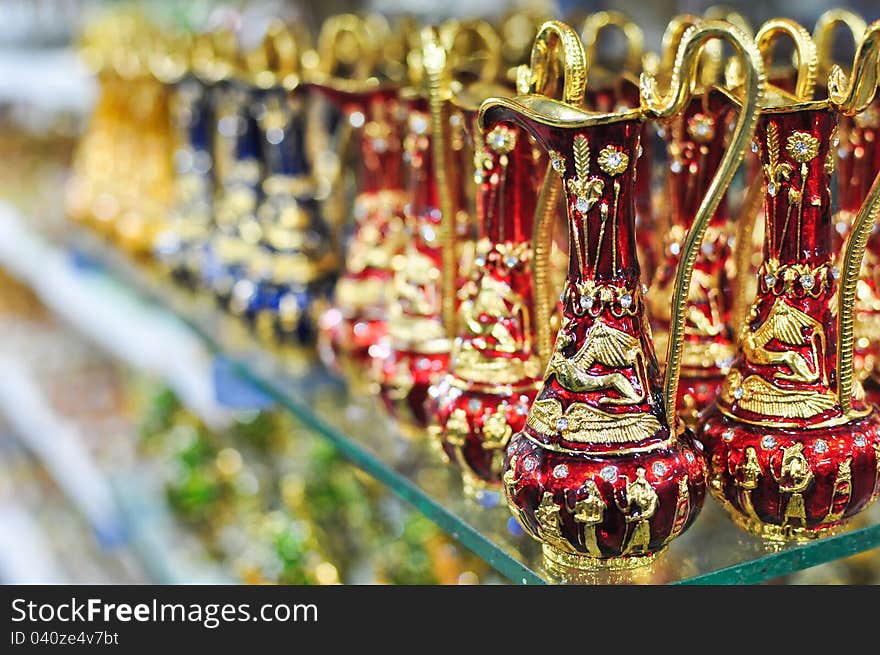 Antique arab kettles on a shelf in a shop