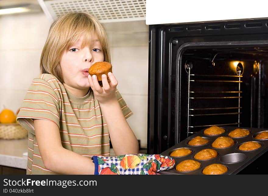 Cute young boy cooking,kitchen