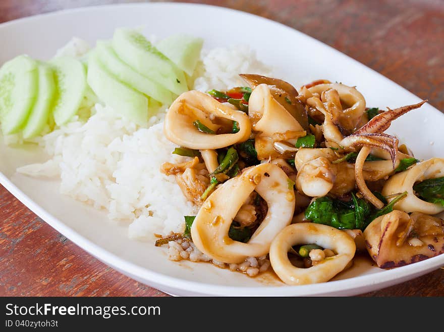 Plain rice cuttlefish with basil leaves