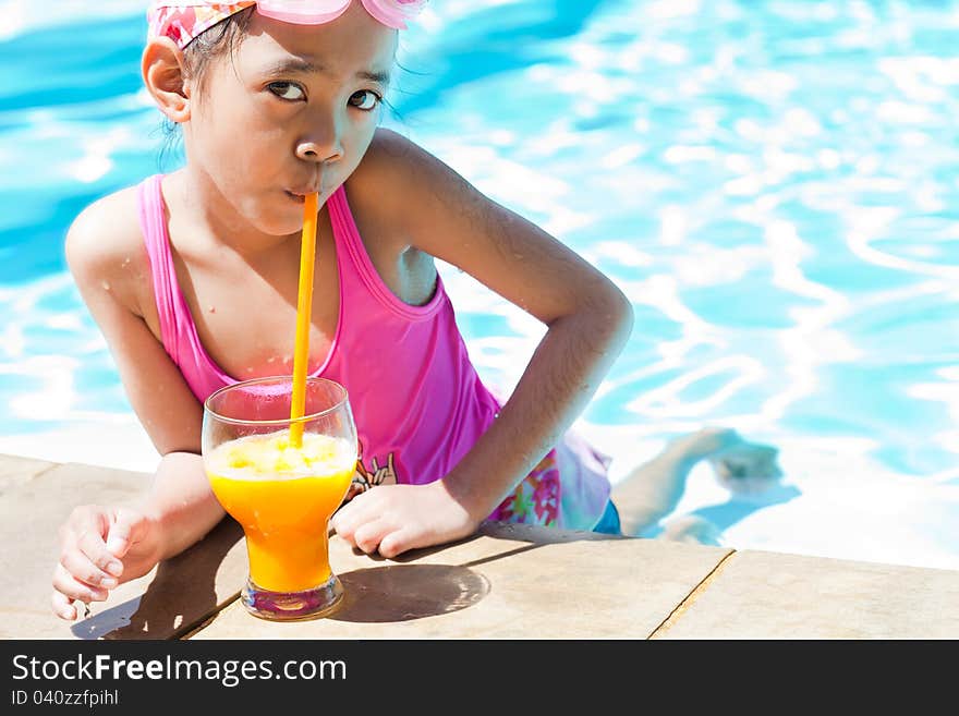 Little girl at swimming pool