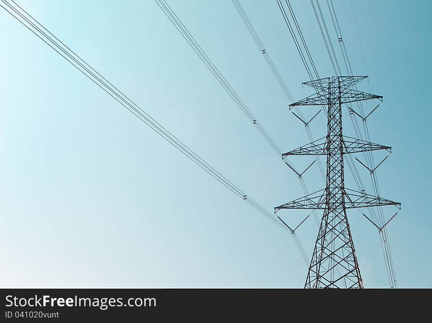 Image of high voltage post with nice sky