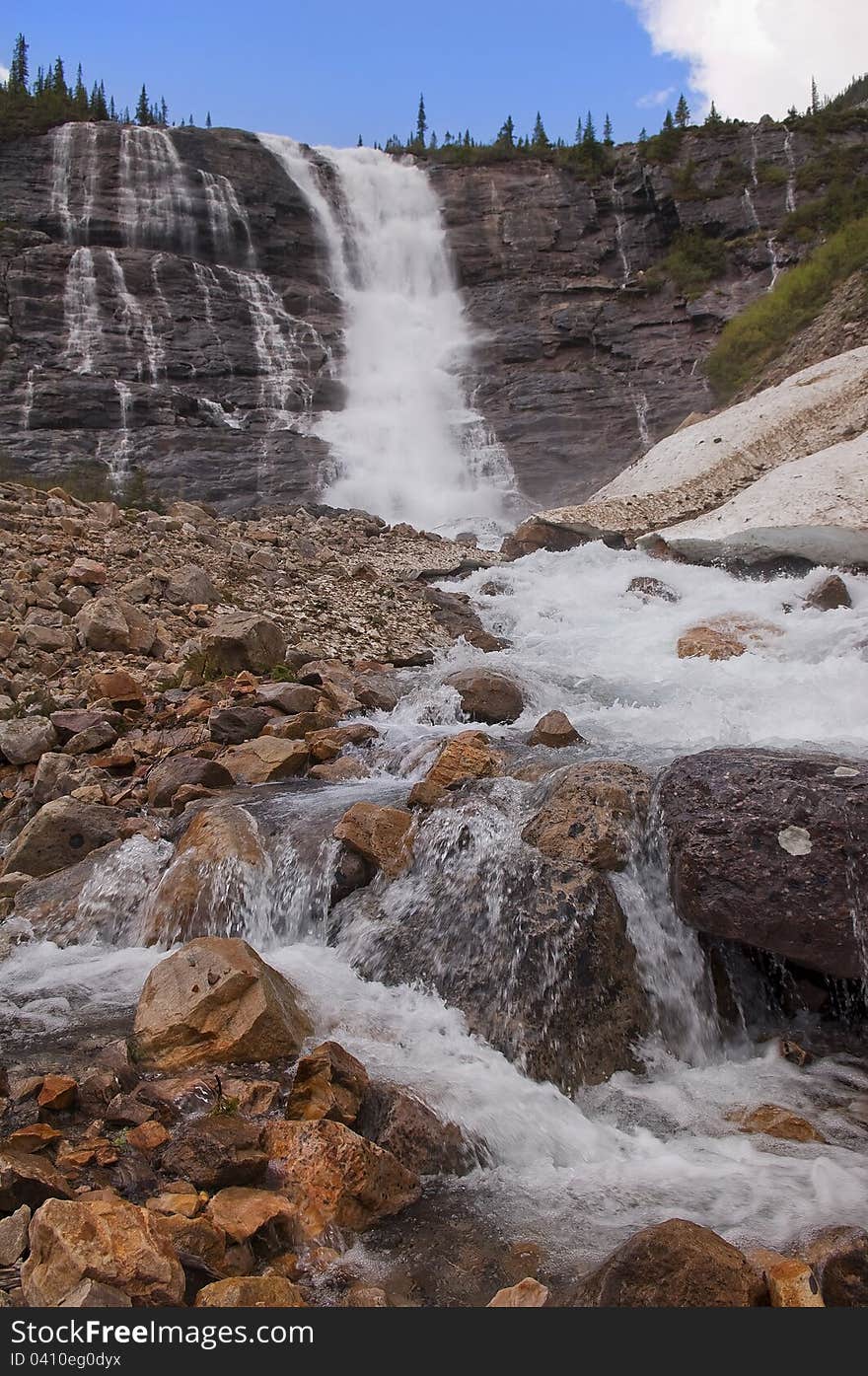 Waterfall In The Mountains